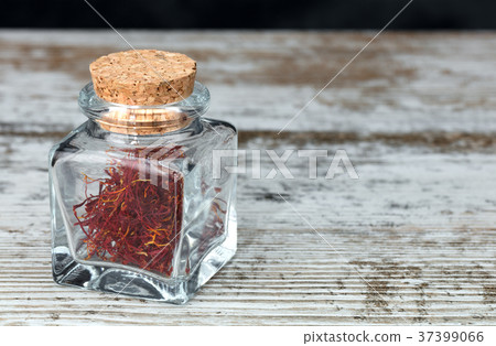 saffron threads in a glass jar saffron threads in a glass jar 37399066