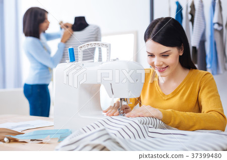 Young women working in a professional atelier 37399480