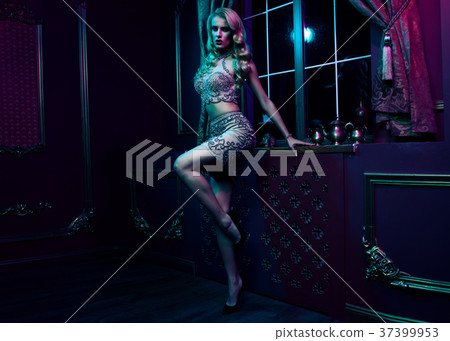 Beautiful sexy blonde woman on violet background Beautiful sexy blonde woman on violet background 37399953