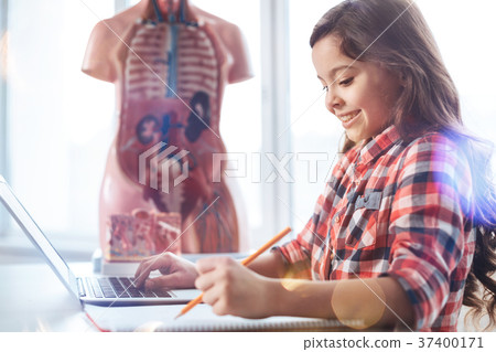 Charismatic active student making some notes 37400171