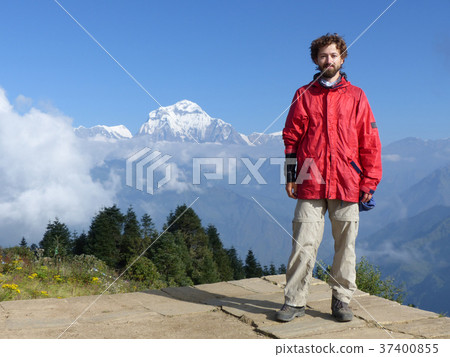Hiker on Poon Hill, Dhaulagiri range, Nepal Hiker on Poon Hill, Dhaulagiri range, Nepal 37400855