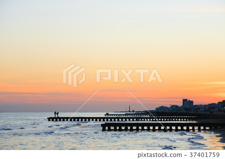 Beach at dawn, piers perspective view 37401759