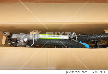 Bike in paper box, photo from unboxing bike. Bike in paper box, photo from unboxing bike. 37401911