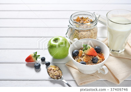 Healthy food, healthy muesli breakfast with milk  Healthy food, healthy muesli breakfast with milk  37409746