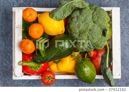 Fresh fruits and vegetables in a white wooden box. Fresh fruits and vegetables in a white wooden box. 37412182
