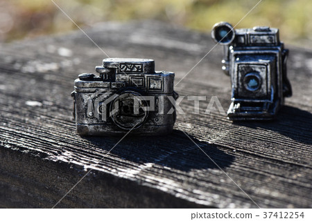 Toy camera placed on the bench 37412254