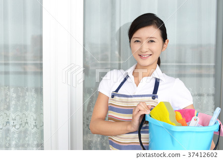 A woman with a cleaning tool A woman with a cleaning tool 37412602