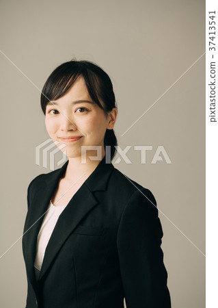 Young woman wearing a suit Young woman wearing a suit 37413541