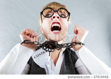 Furious woman with chained hands and contract 37414448