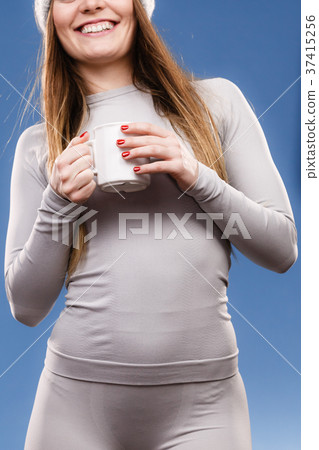 girl in thermal underwear drinking tea girl in thermal underwear drinking tea 37415256