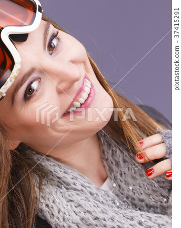 Woman in ski googles warm winter clothing portrait 37415291