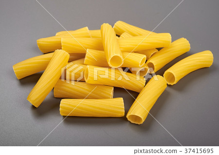 Rigatoni italian pasta isolated on grey background Rigatoni italian pasta isolated on grey background 37415695