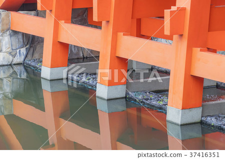Columns of the red bridge with brook Columns of the red bridge with brook 37416351