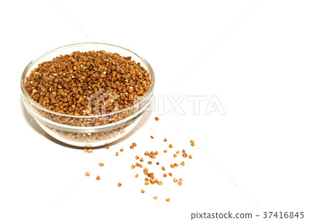 buckwheat in a glass bowl isolated on white. buckwheat in a glass bowl isolated on white. 37416845
