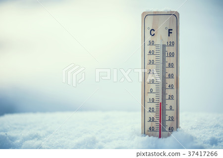 Thermometer on snow shows low temperatures. Thermometer on snow shows low temperatures. 37417266
