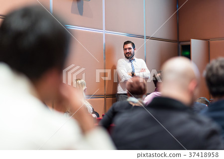 Speaker Giving a Talk at Business Meeting. Speaker Giving a Talk at Business Meeting. 37418958