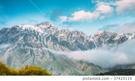 Clouds Over Rocks. Mountain Peaks Covered With Clouds Over Rocks. Mountain Peaks Covered With 37420119