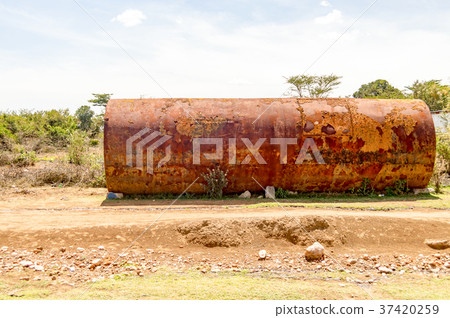 Old rusty tanker on a dirt road 37420259