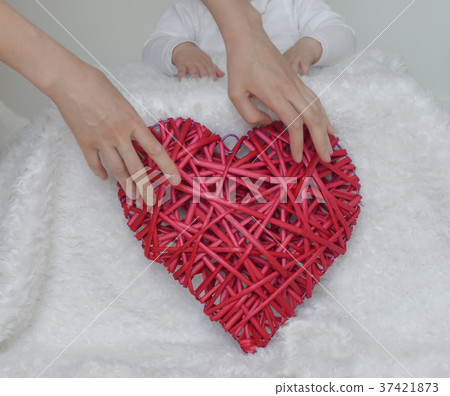 Red heart in the hands of mother Red heart in the hands of mother 37421873