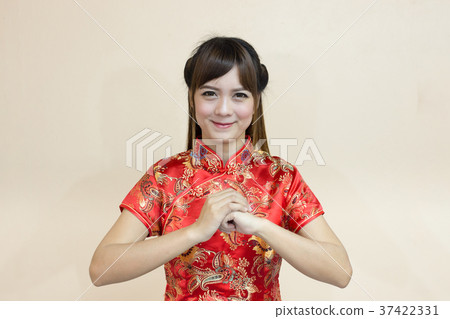 Asian woman greeting in traditional Chinese  37422331