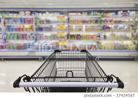 Supermarket aisle with empty shopping cart Supermarket aisle with empty shopping cart 37424597
