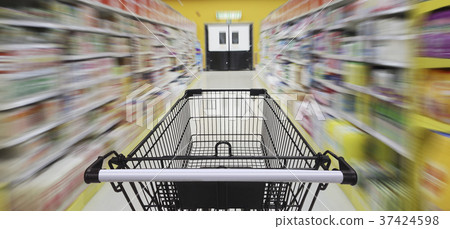 Supermarket aisle with empty shopping cart Supermarket aisle with empty shopping cart 37424598