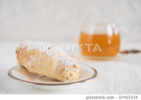 Tasty eclair on plate Tasty eclair on plate 37425234