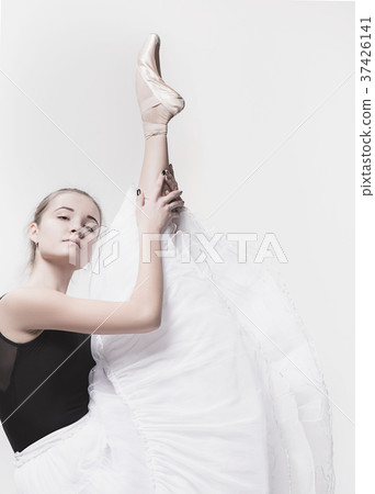 Young classical dancer isolated on white Young classical dancer isolated on white 37426141