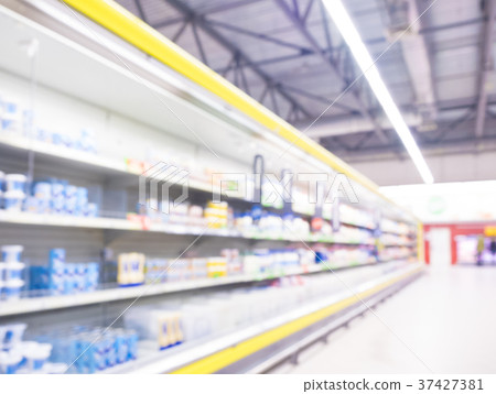 Defocused blur of supermarket shelves Defocused blur of supermarket shelves 37427381