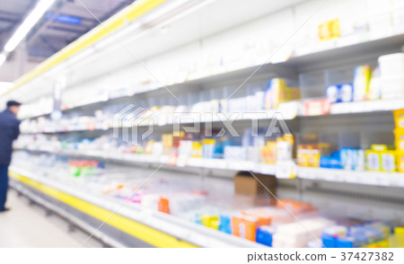 Defocused blur of supermarket shelves 37427382