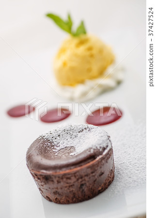delicious chocolate hot cake with fruit sauce delicious chocolate hot cake with fruit sauce 37427524