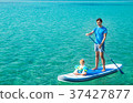 Father with His Son on SUP. Stand Up Paddling. 37427877