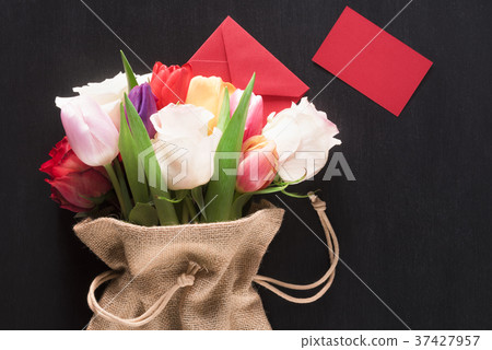 Flowers in a jute sack and a message card Flowers in a jute sack and a message card 37427957