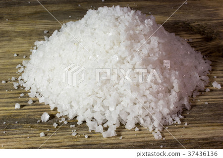 Large sea salt on wooden background Large sea salt on wooden background 37436136