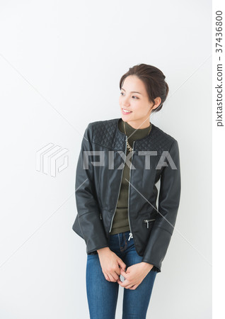 Woman wearing a leather jacket Woman wearing a leather jacket 37436800
