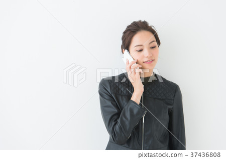 Woman wearing a leather jacket Woman wearing a leather jacket 37436808