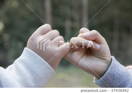 The hands of the children doing the finger cutting 37436942