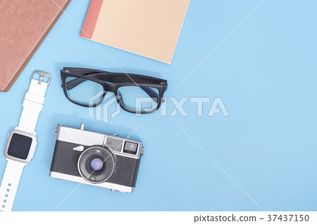 Hipster blogger travel objects on blue Hipster blogger travel objects on blue 37437150