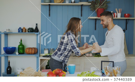 Cheerful and attractive young couple in love Cheerful and attractive young couple in love 37440389