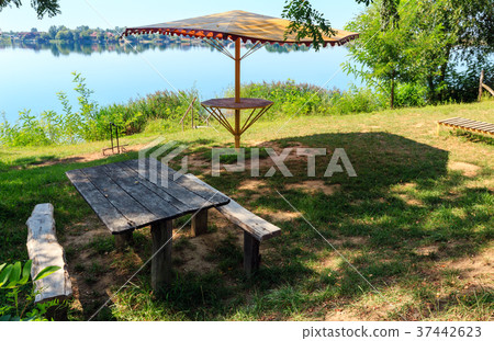 Ð¡amping pitch on summer lake calm beach 37442623