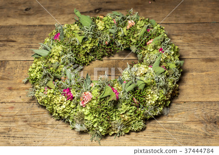 a beautiful flower wreath isolated on awooden 37444784