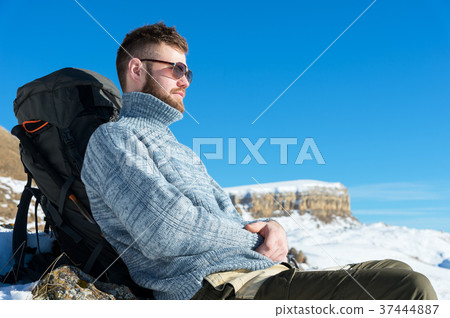 Portrait of a traveler hipster in sunglasses and a 37444887