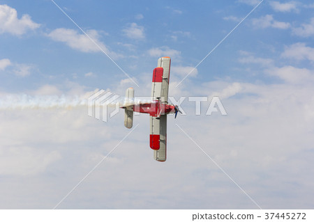 Aircraft AN-2 in turn against the sky with clouds Aircraft AN-2 in turn against the sky with clouds 37445272