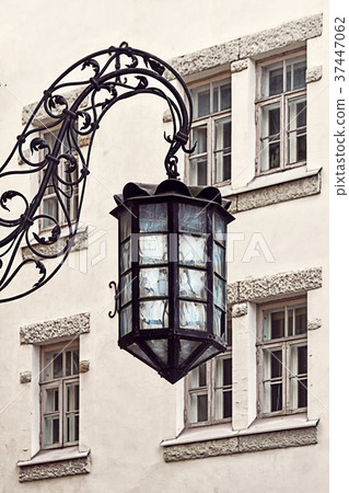 Old lantern hangs in old city of Tallinn. 37447062