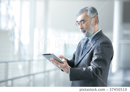 Businessman using tablet device president executive business image 37450519