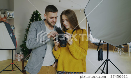 Professional photographer man showing photos on Professional photographer man showing photos on 37450911