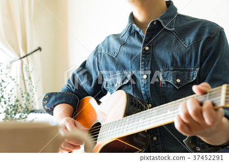 Man playing guitar 37452291