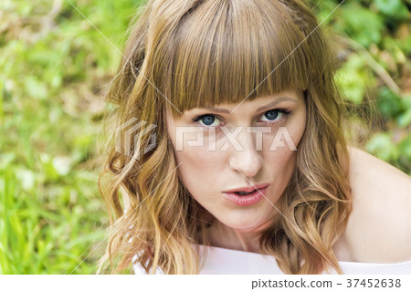 Portrait of young woman with blond hair Portrait of young woman with blond hair 37452638