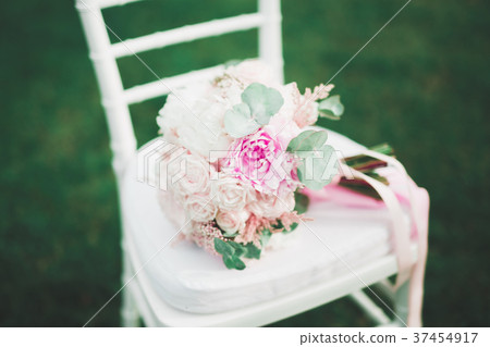 Beautiful wedding bouquet with different flowers Beautiful wedding bouquet with different flowers 37454917