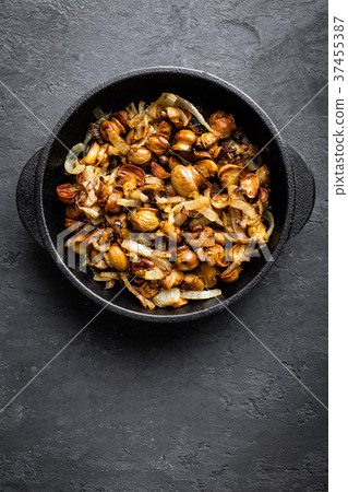 Mushrooms fried with onion, top view Mushrooms fried with onion, top view 37455387